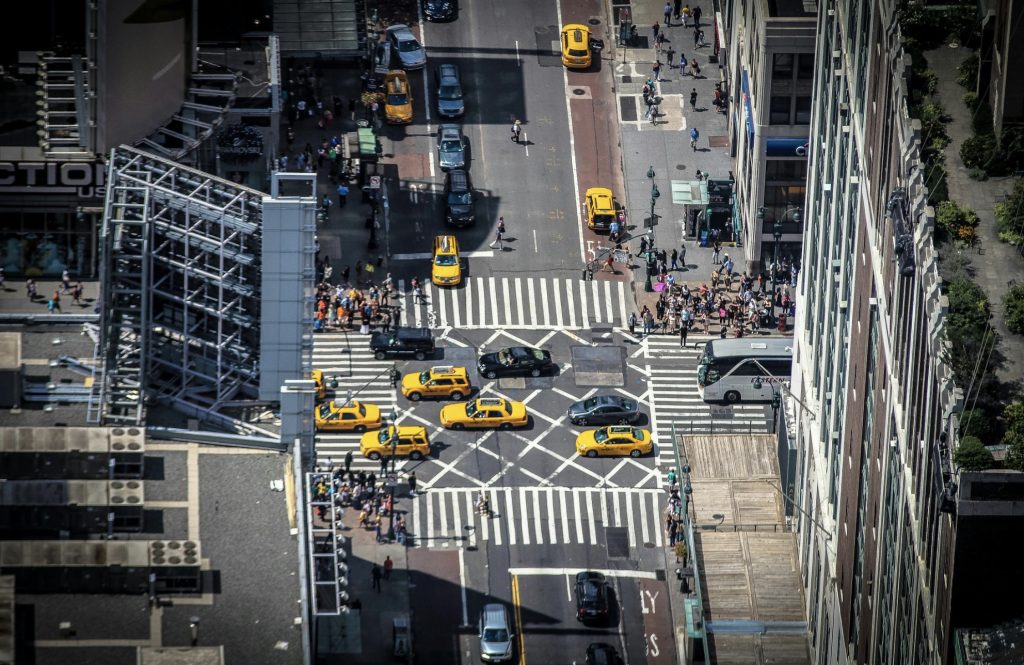 Aerial photo of downtown city with taxis driving